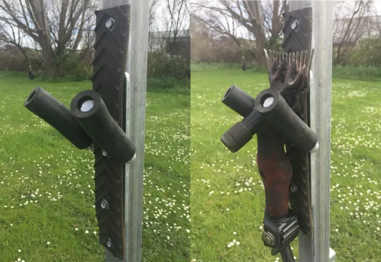 Close-up of a shearing handpiece hanging on a hook